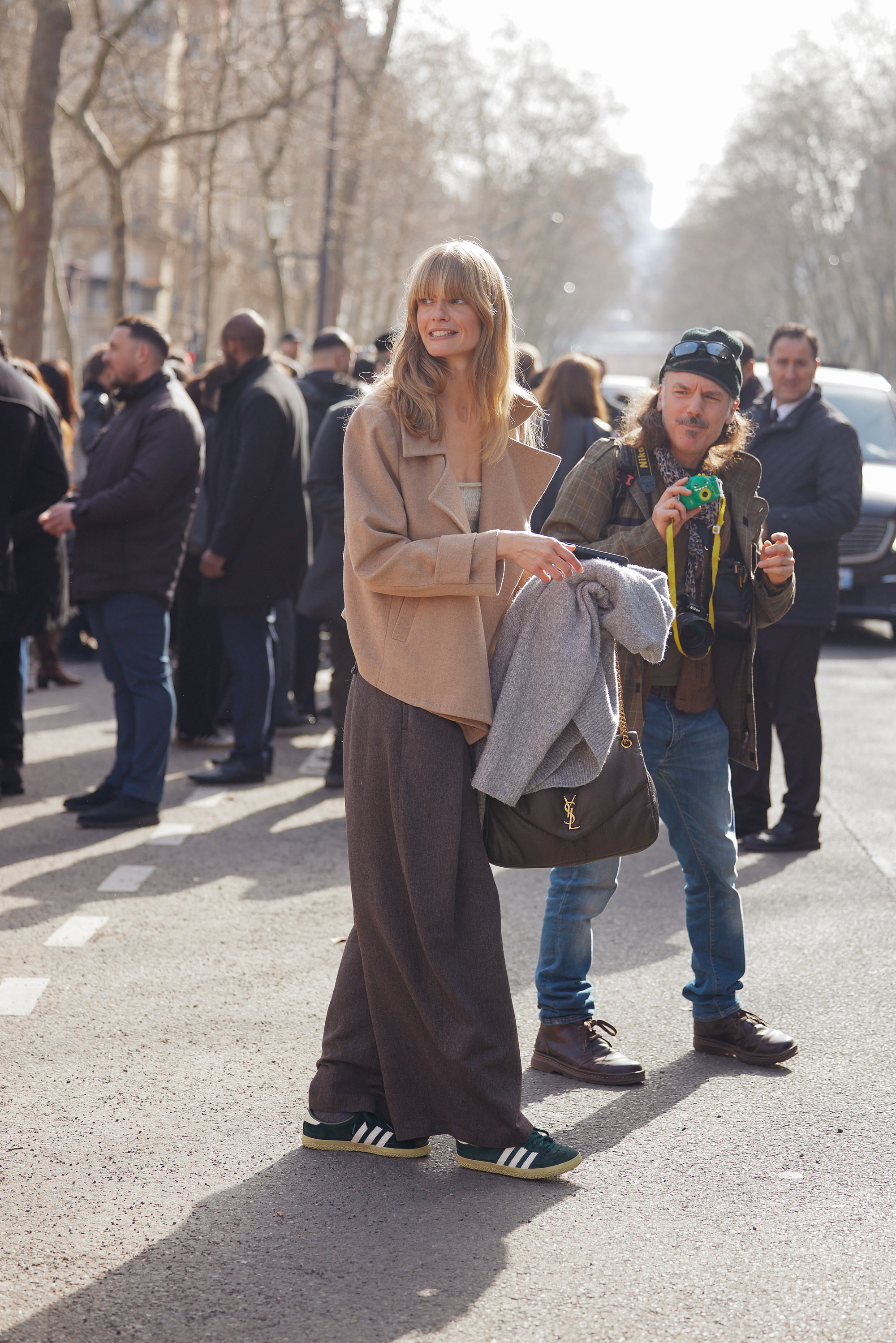 A fashion person wears Paris fashion week street style trainer trends march 2026.