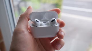 The AirPods Pro being held in hand