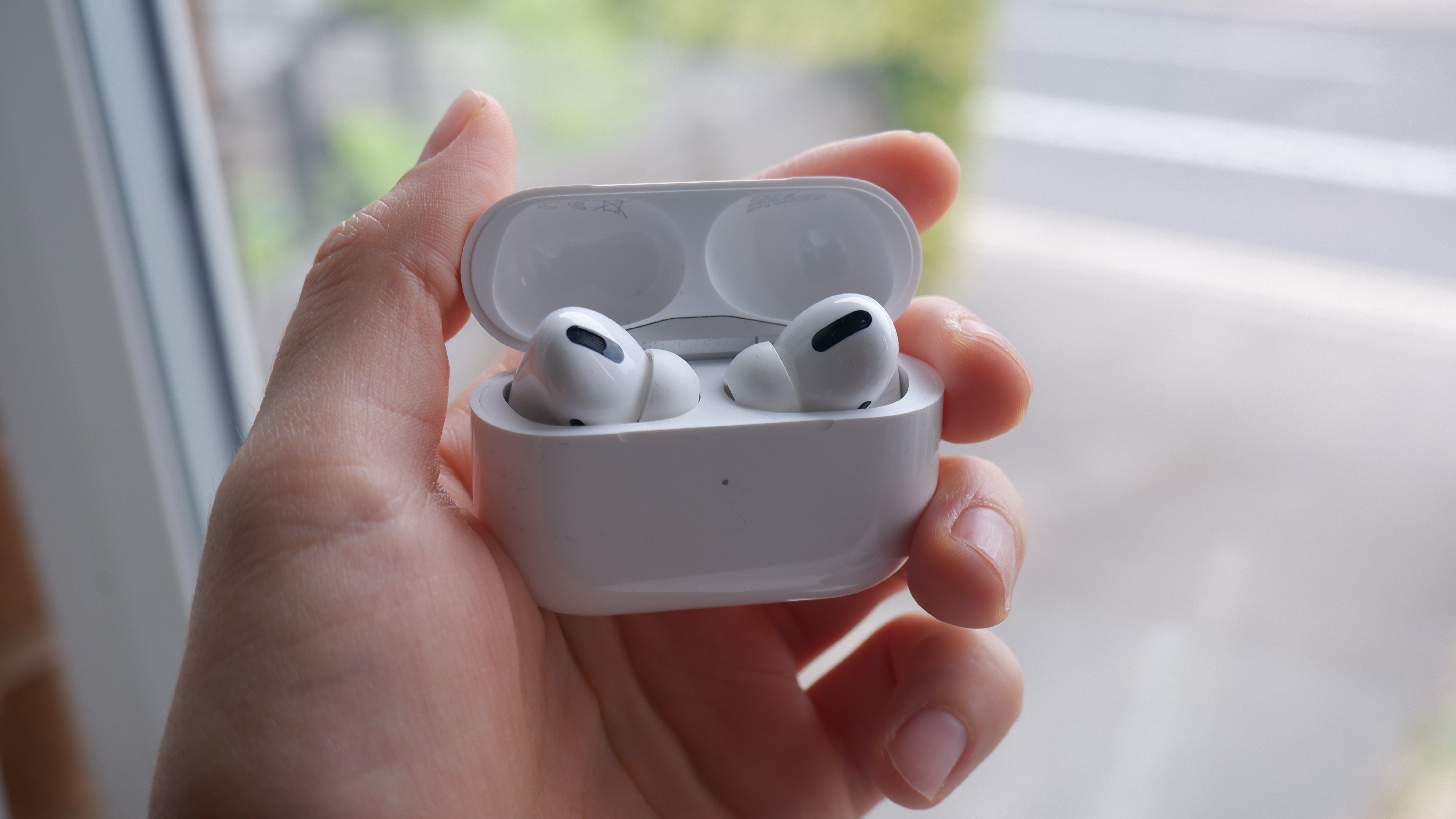 AirPods Pro held in hand