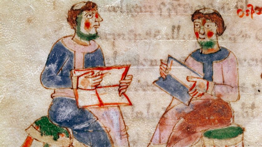 A painting of two balding monks sitting on green stools showing each other books