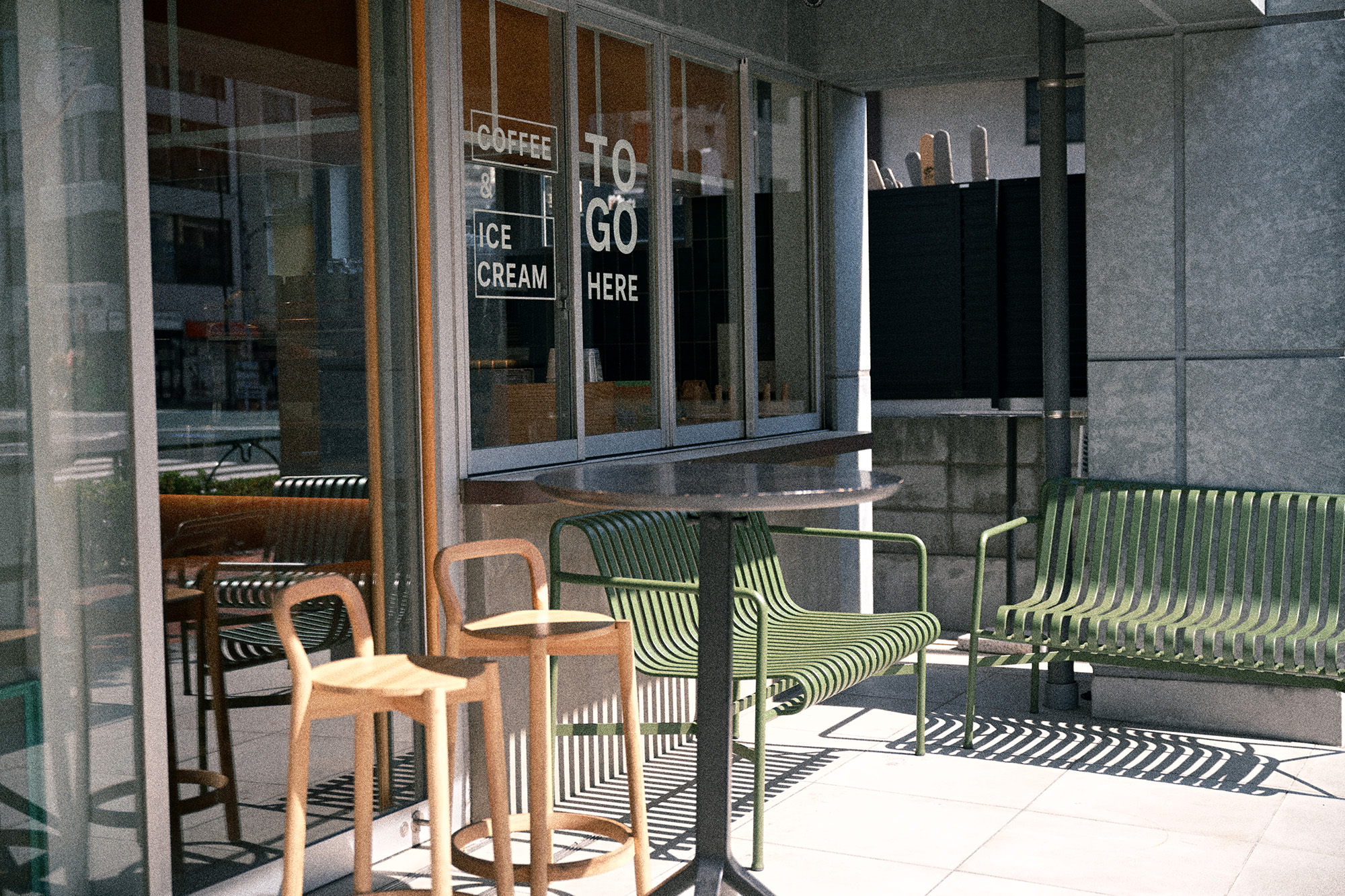 Nikon Zf Film Grain image, showing outside a cafe with chairs in foreground