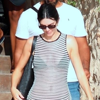 Kendall Jenner wearing a sheer DISSH dress with The Row flip flops in Ibiza August 2024