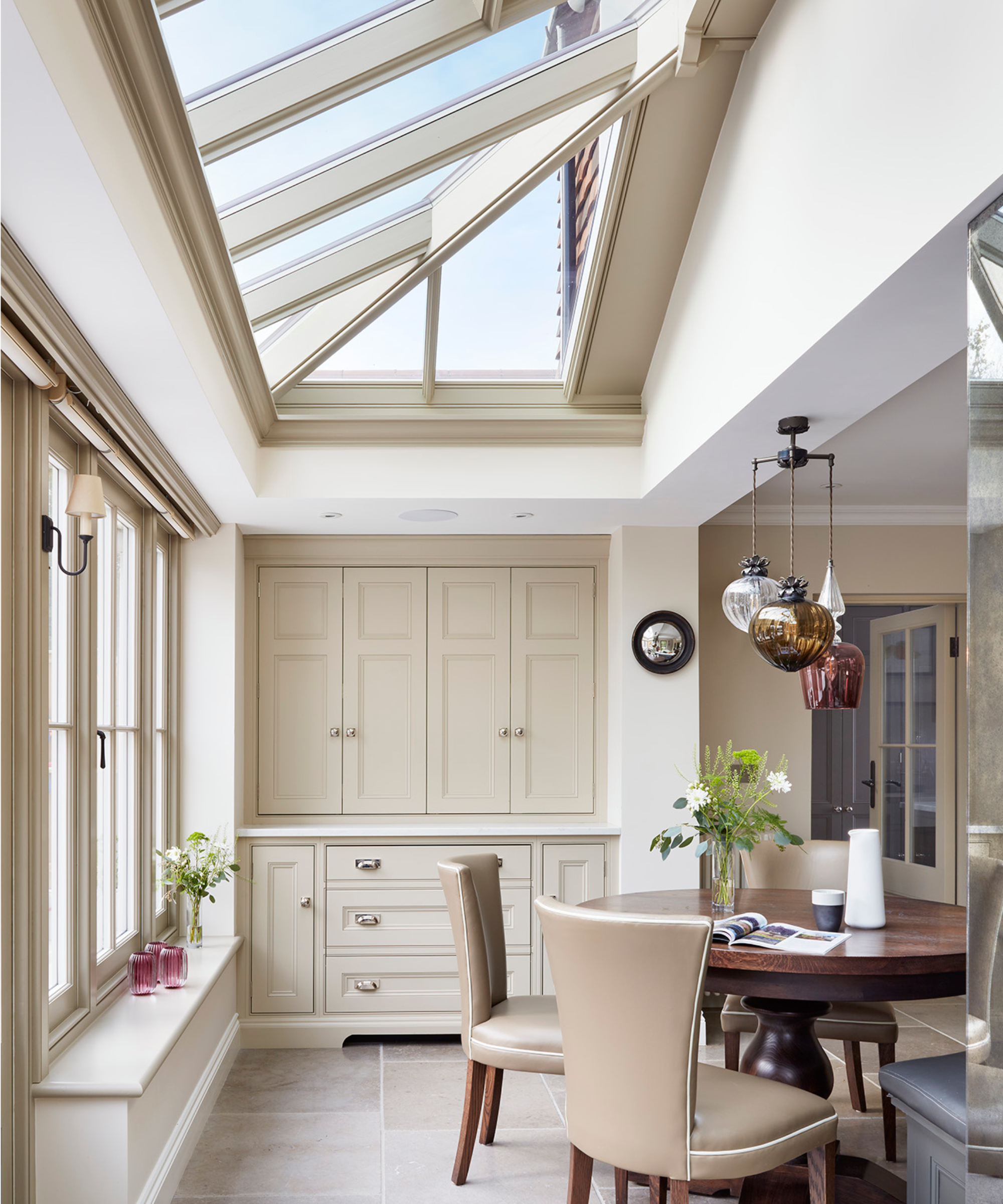 internal shot looking up at detailed roof on cream wooden lean to conservatory