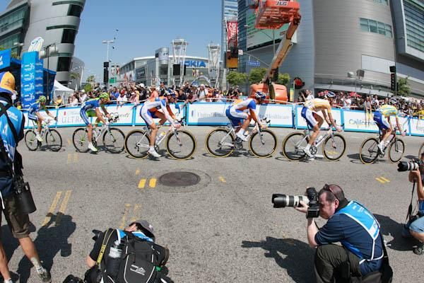 Photographers snap the field as it streams past on one of six circuits through downtown Los Angeles.