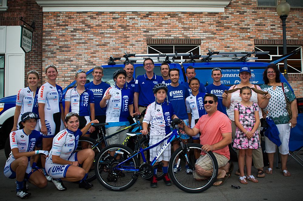 The UnitedHealthCare Children's Foundation presenting the Rodrigues family a grant for medical assistance to their two children suffering from hearing loss. Both children (Tristan and Daniel) became a UHC "Pro for a Day", receiving race kits, and a new bike.