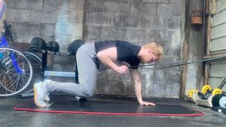 Fitness writer Harry Bullmore performing core exercises with a resistance band