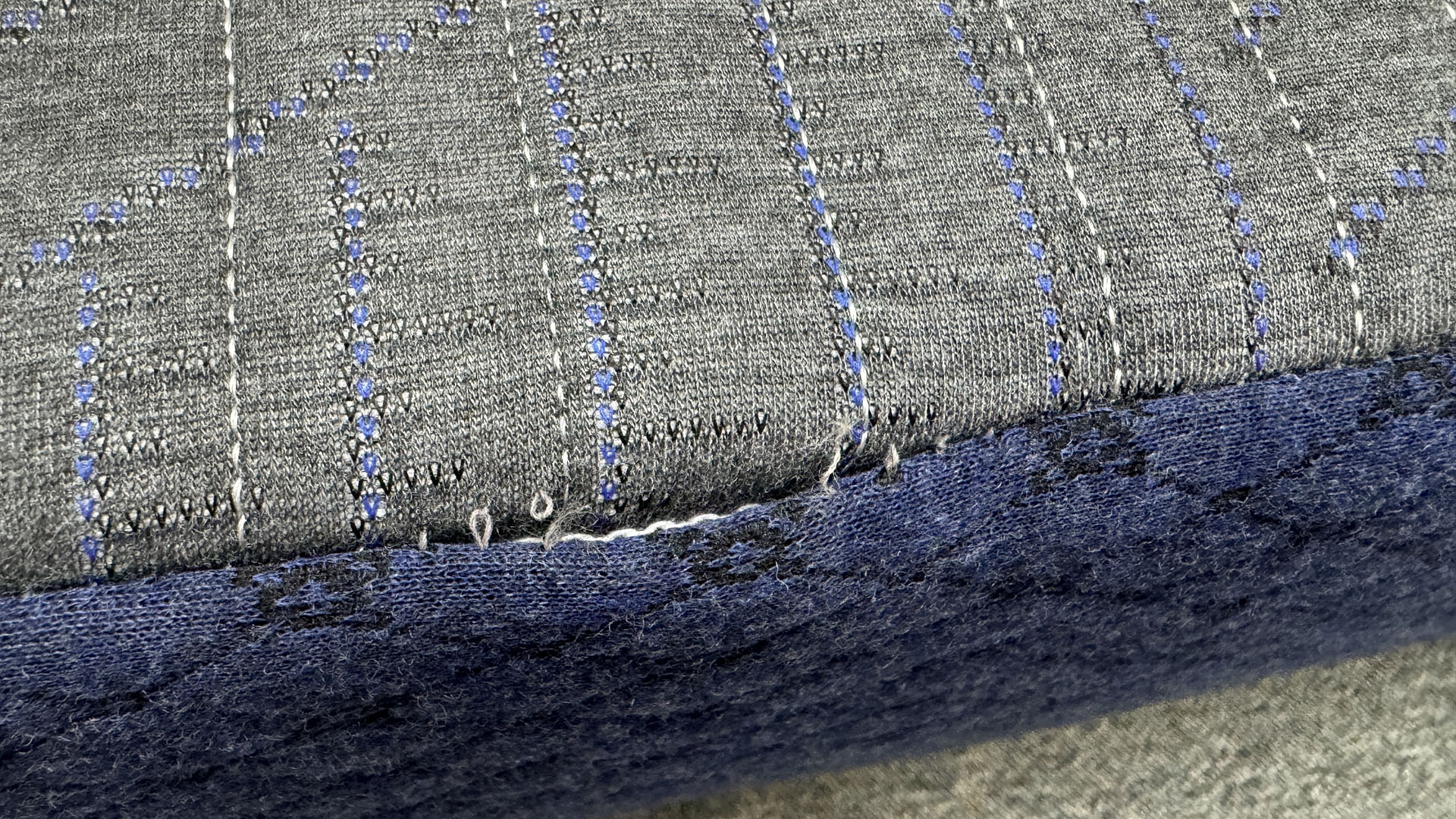 Close up of stitching coming loose on Brooklyn Bedding DreamFoam Essential mattress