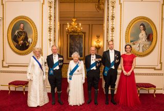 Queen Elizabeth II (3L) stands with her husband Britain's Prince Philip, Duke of Edinburgh (3R), her son Britain's Prince Charles, Prince of Wales (2L) and his wife Britain's Camilla, Duchess of Cornwall (L), and her grandson Britain's Prince William, Duke of Cambridge (2R) and his wife Britain's Catherine, Duchess of Cambridge