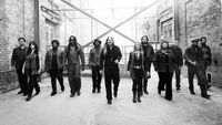 Tedeschi Trucks Band walking down an alley