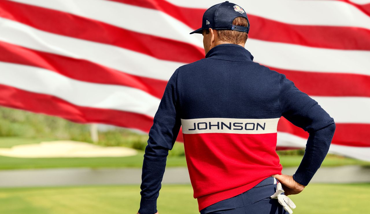 Zach Johnson stands with his back to the camera