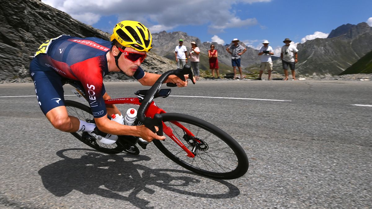 Tom Pidcock railing a corner on the Galibier