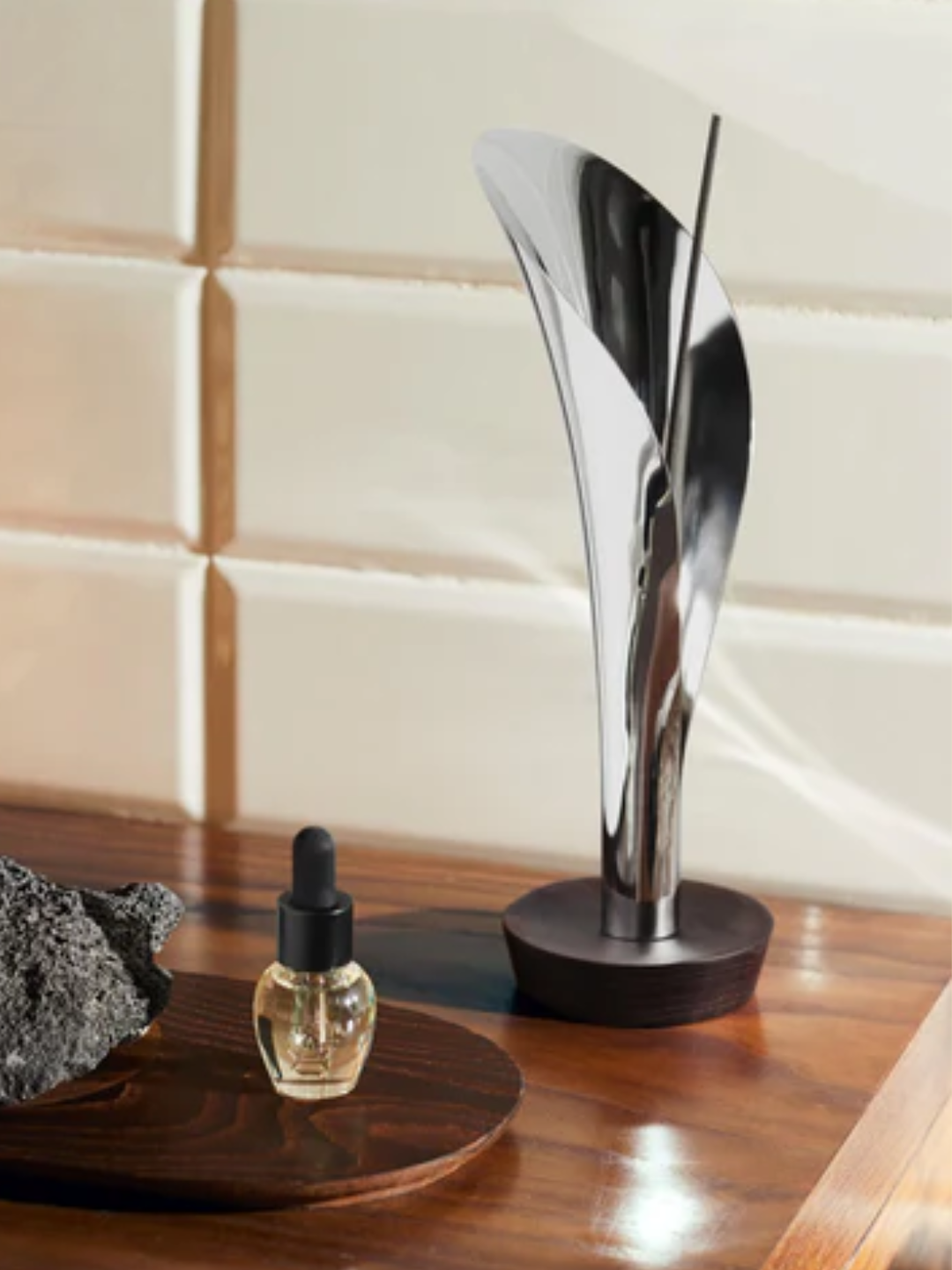A silver fluted incense holder from Alessi