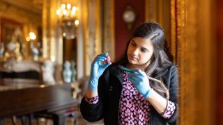 Collections and House Manager Naomi Kulasingham cleans a Fabergé egg at Polesden Lacey for Hidden Treasures of the National Trust season 2