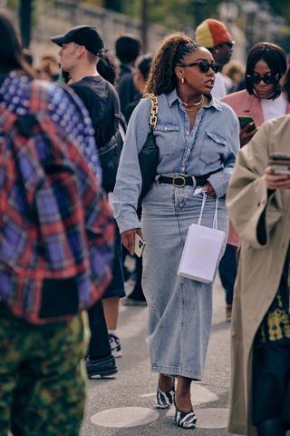Lindsay Peoples wearing a denim shirt and denim maxi skirt at Paris Fashion Week in March 2024