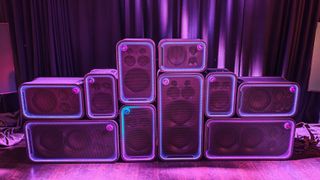 Multiple Sony ULT Tower speakers stacked on top of one another