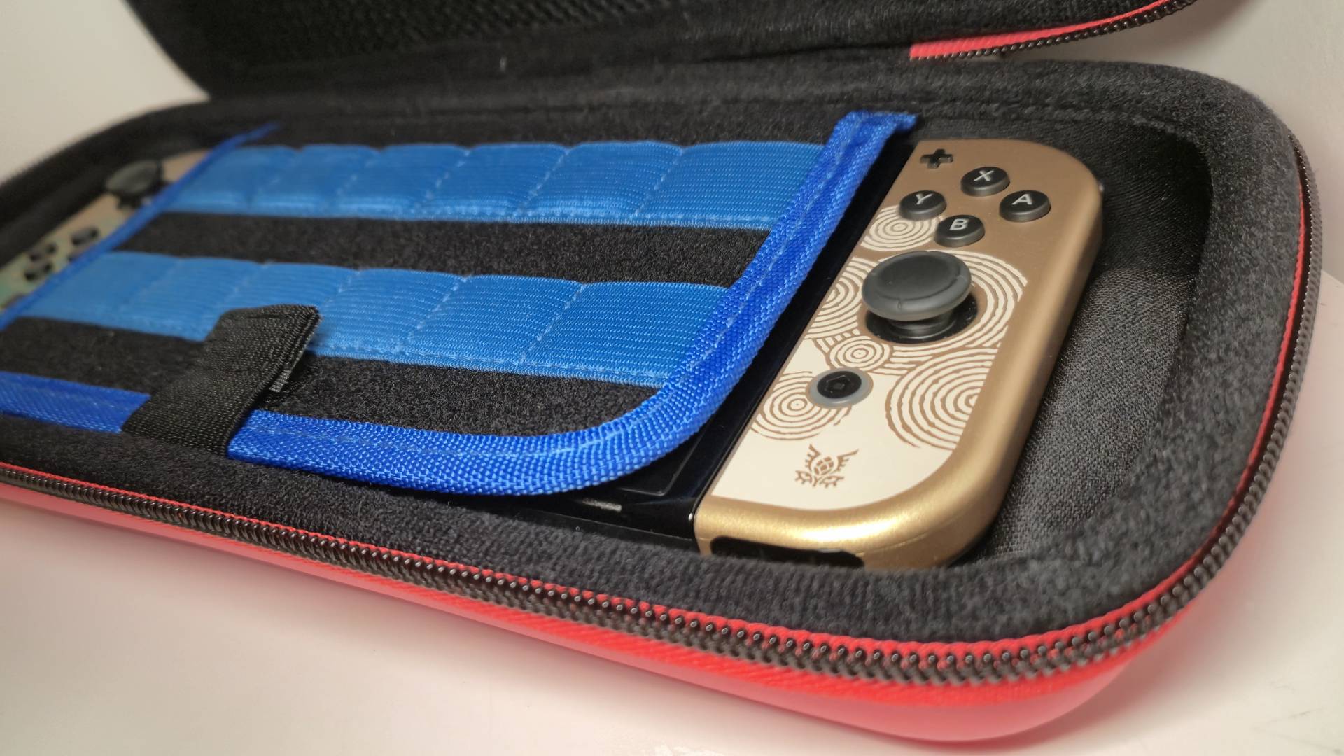 Photo of the Legend of Zelda Tears of the Kingdom Switch OLED sitting inside the Mario Bricks case.