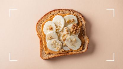 Wholemeal toast with peanut butter and banana, representing the best time of day to snack
