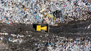 Aerial top drone view of garbage pile, trash dump, landfill, waste from household dumping site. Consumerism and contamination concept