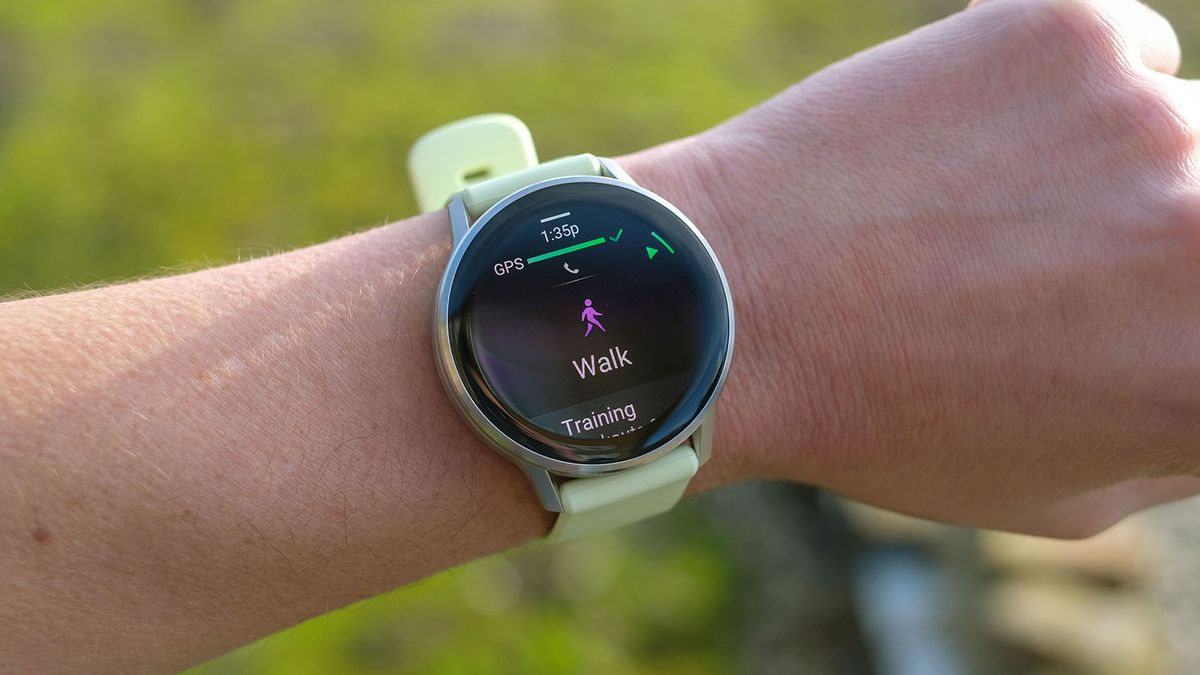 a picture of our reviewer wearing the Garmin Venu 4 smartwatch displaying the Walk sports mode