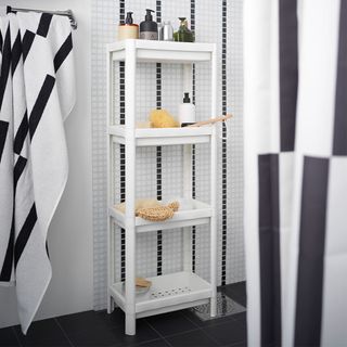 shower storage ideas with black and white towels and shower unit