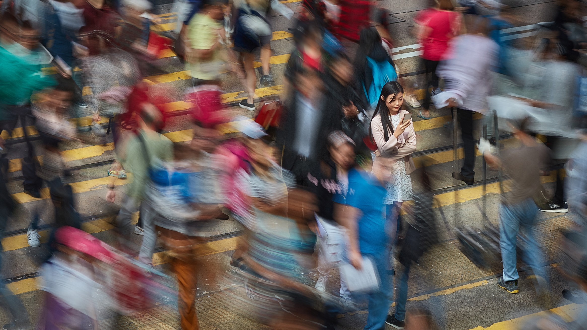 A women stood still in a crowd