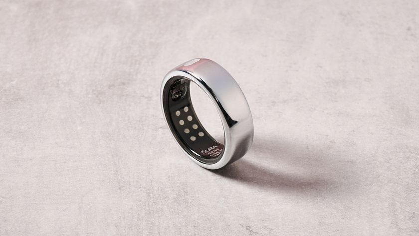 The Oura Ring 3 upright on a table, showing the internal sensors.