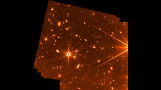 This engineering image captured by the Fine Guidance Sensor reveals the deepest view of the universe in infrared light to date. The false-color image reveals a handful of stars and hundreds of galaxies scattered across the distant universe.