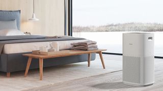 A Levoit air purifier in a modern bedroom