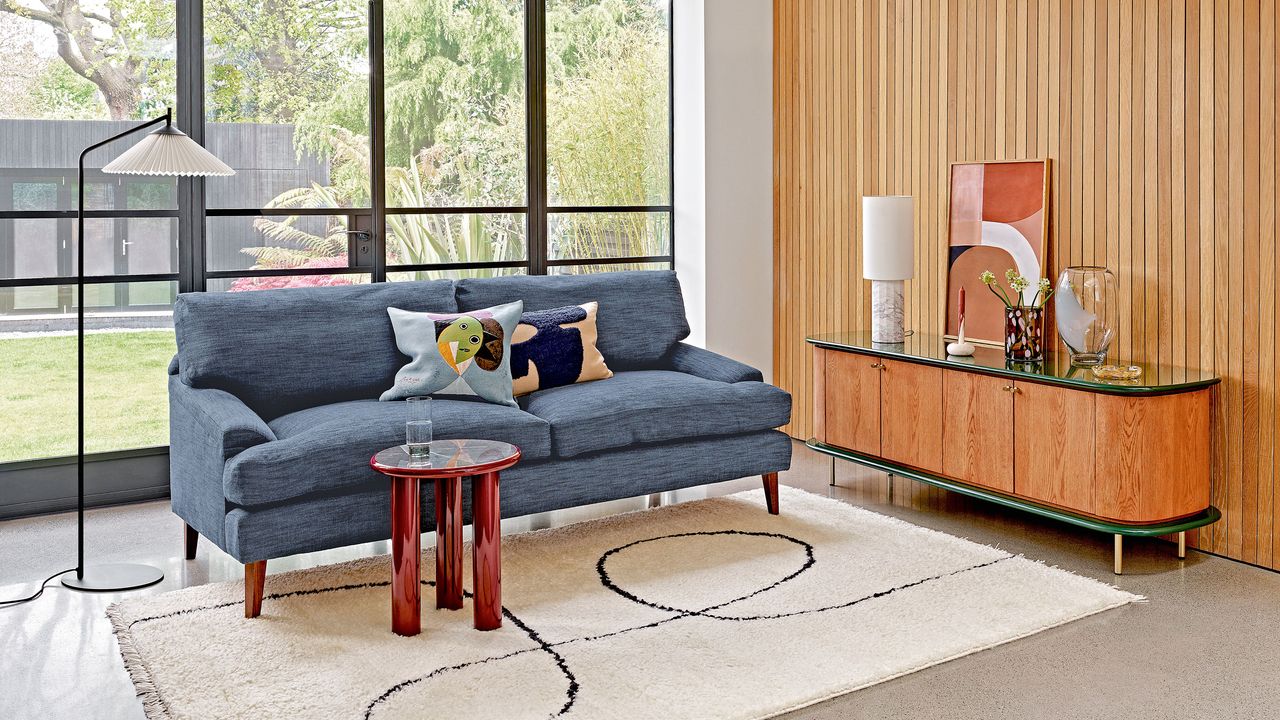 Neutral living room with blue sofa