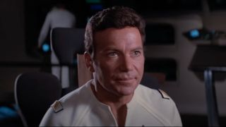William Shatner as Captain Kirk on the bridge of the Enterprise. 