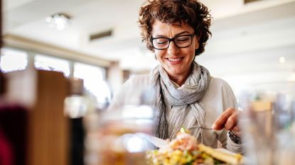 Woman eating a meal.