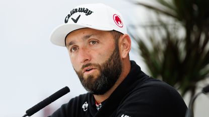 Jon Rahm speaks into a microphone at his pre-Scottish Open press conference