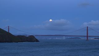 A photo of the 'blood moon' hovering above the Golden Gate Bridge in San Francisco.