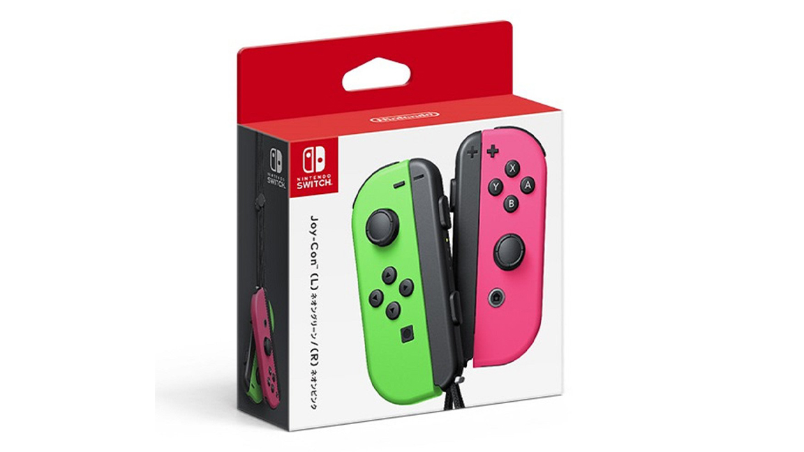 A photo of green and pink JoyCon controllers