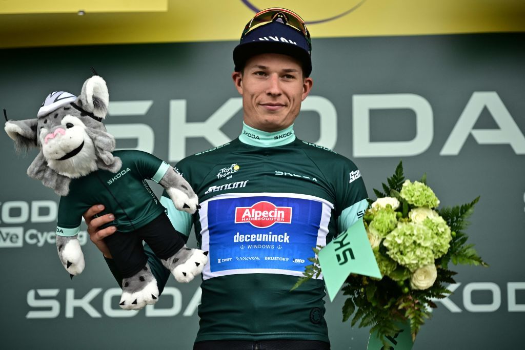 AlpecinDeceunincks Belgian rider Jasper Philipsen celebrates on the podium with the best sprinters green jersey after the 4th stage of the 110th edition of the Tour de France cycling race 182 km between Dax and Nogaro in southwestern France on July 4 2023 Photo by Marco BERTORELLO AFP Photo by MARCO BERTORELLOAFP via Getty Images
