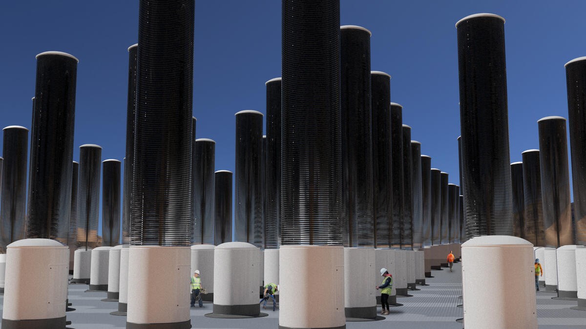 Artist impression of a mechanical tree forest. There are lots of tall, cylindrical 