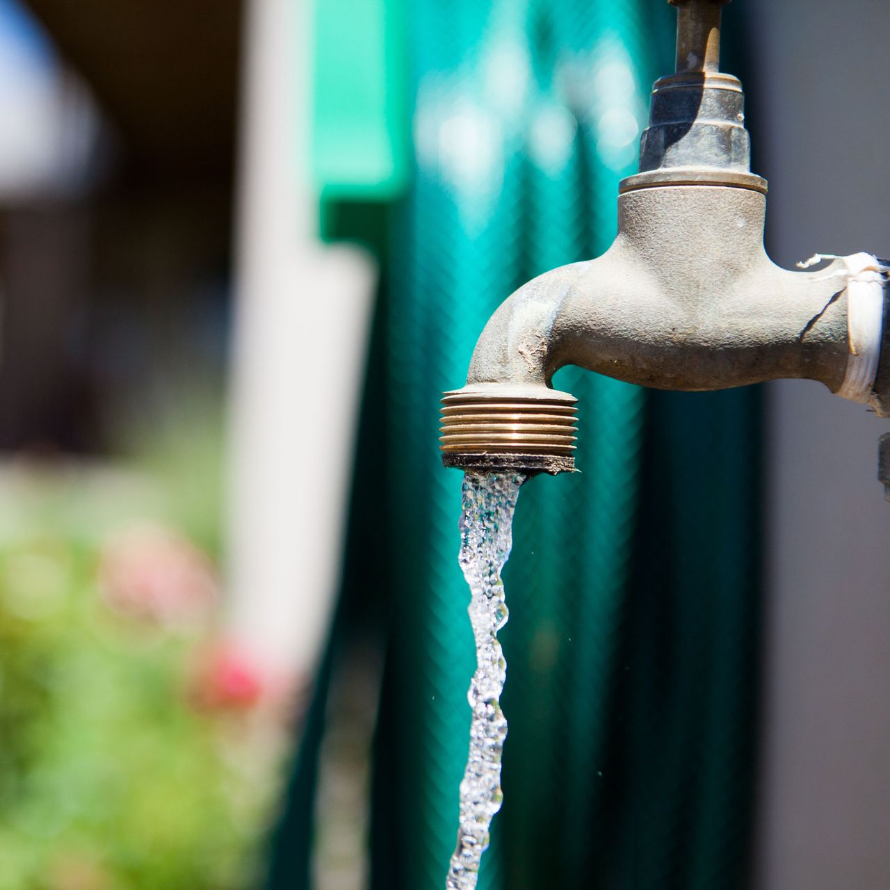 running garden tap and hose
