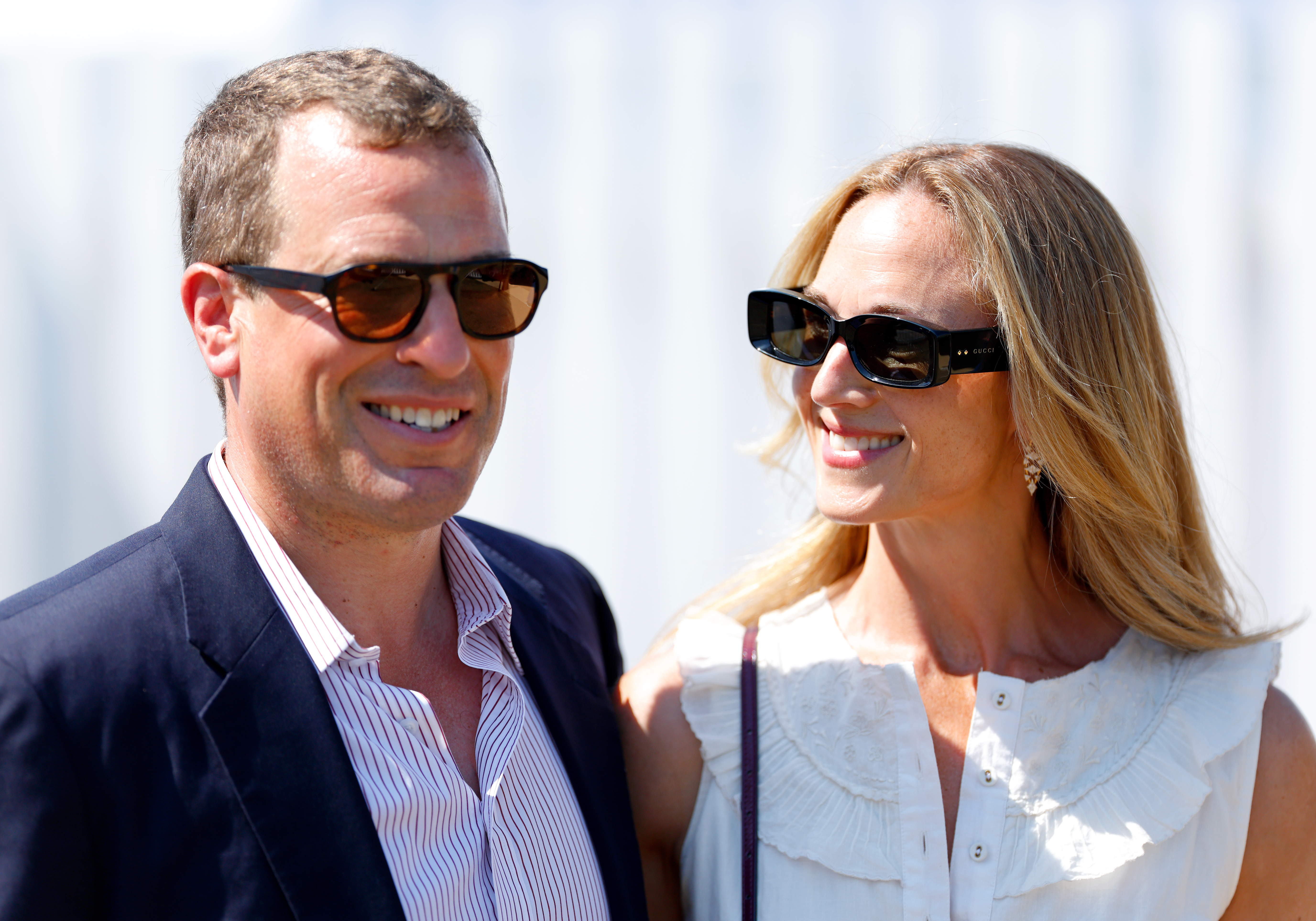 Peter Phillips and Harriet Sperling smiling in sunglasses