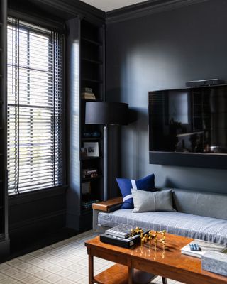 dark grey home office with sofa by Studio Munroe
