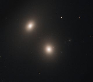 two white galaxies in deep space
