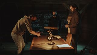 Photo showing Ilkka Villi, Anssi Maatta, and Sam Lake on the Alan Wake 2 live action set filming a scene in the Writer's Room
