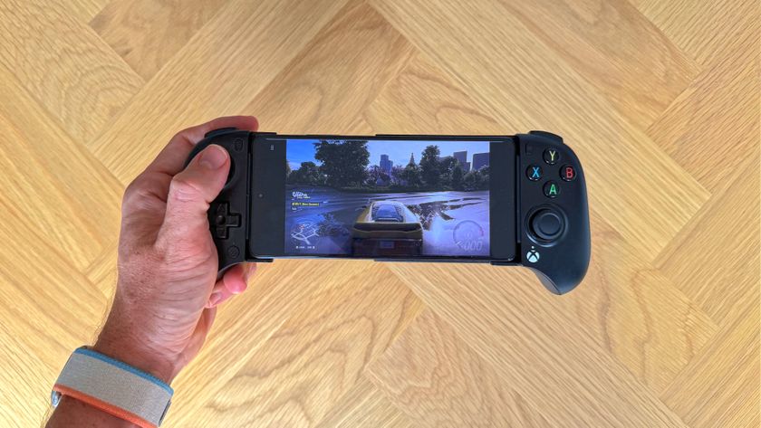 The 8BitDo Ultimate Mobile Gaming Controller - Xbox Edition with the background of a wooden surface.