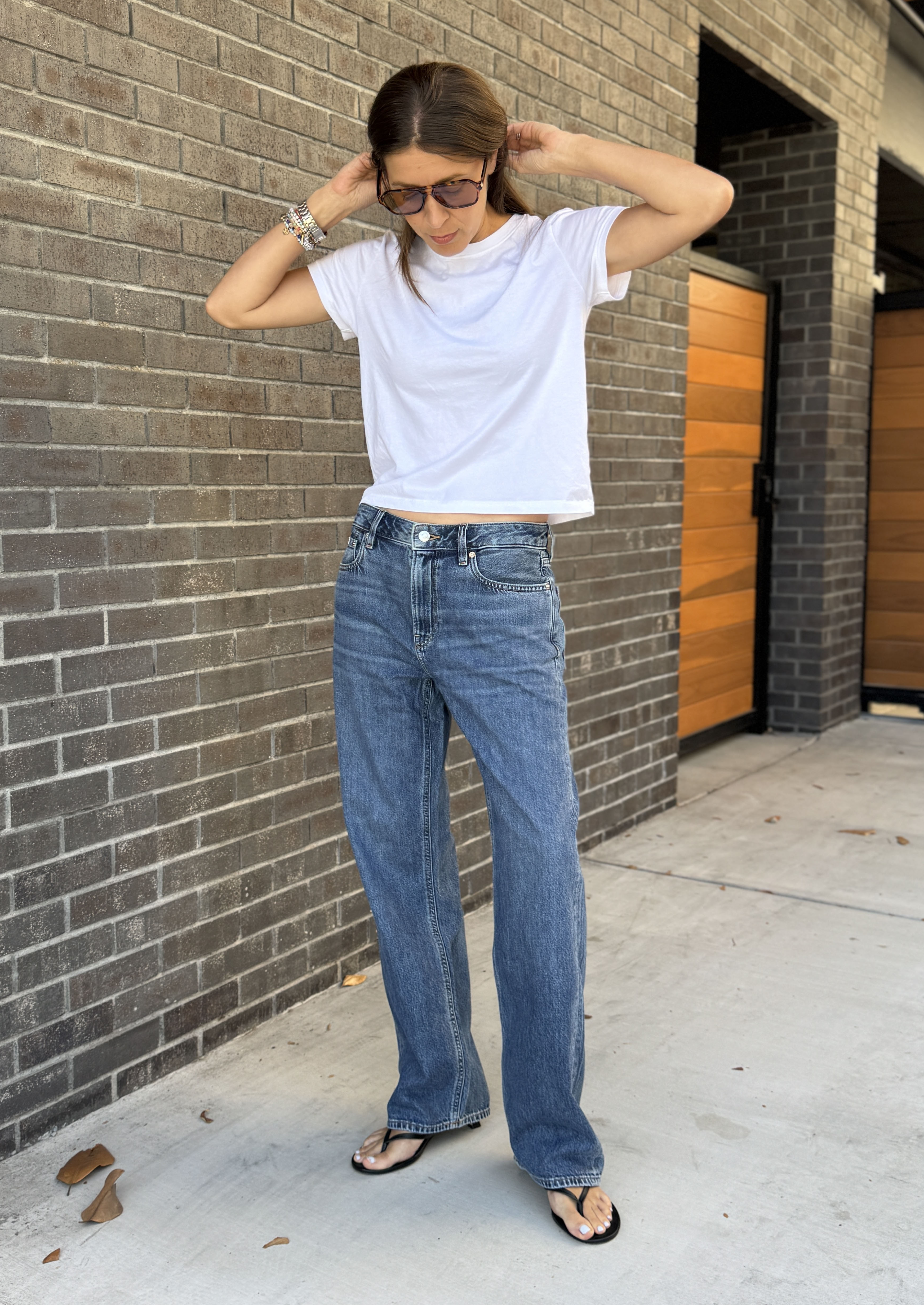 Judith Jones wearing Calvin Klein jeans and a white tee.
