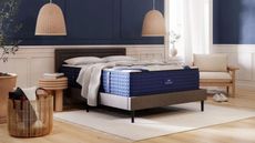 The DreamCloud Luxury Hybrid Mattress on a bed in a bedroom.