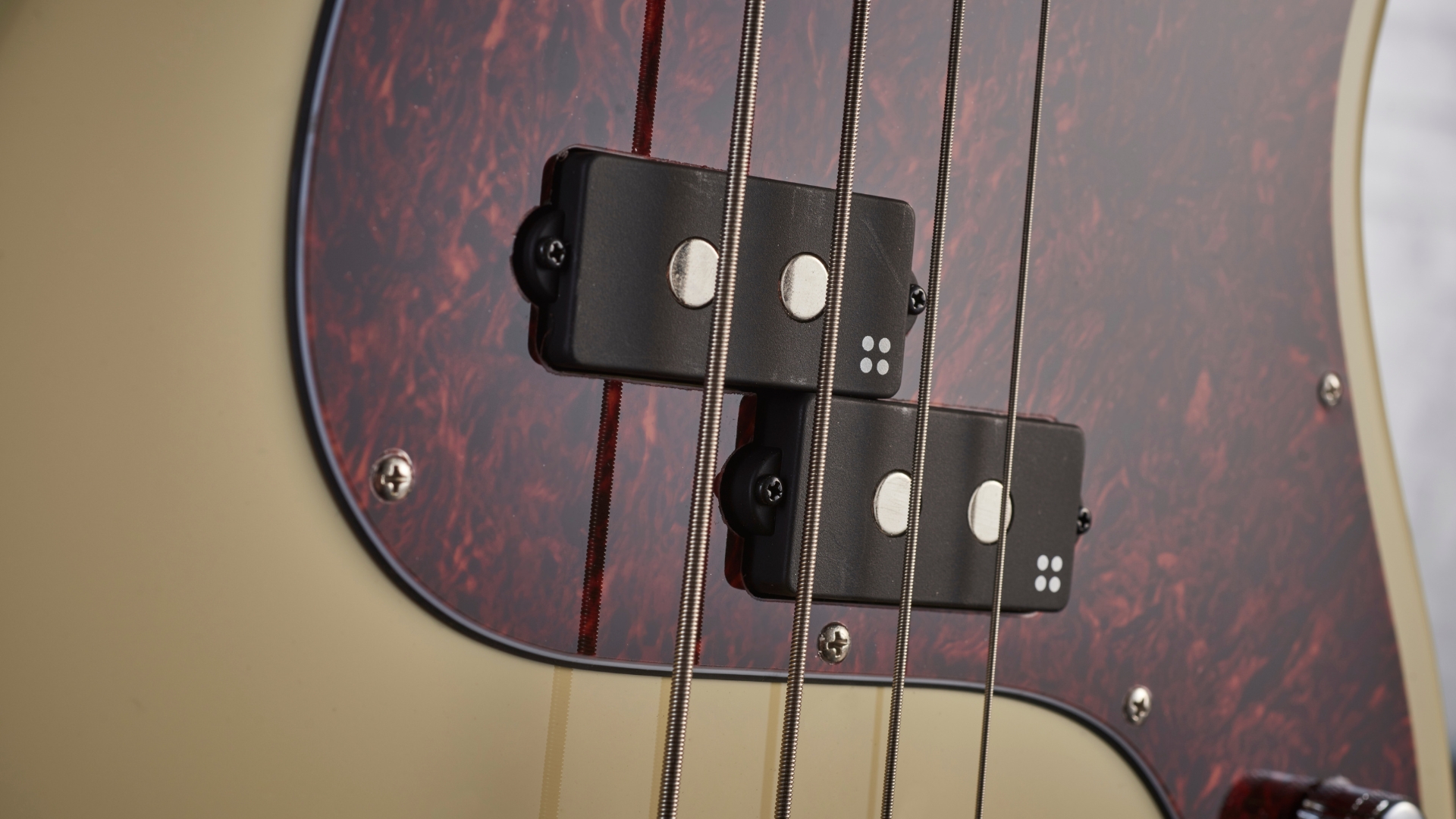 Close up of a split coil pickup on a bass guitar
