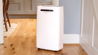The Pro Breeze 50-pint Dehumidifier on a hard wood floor in a home environment