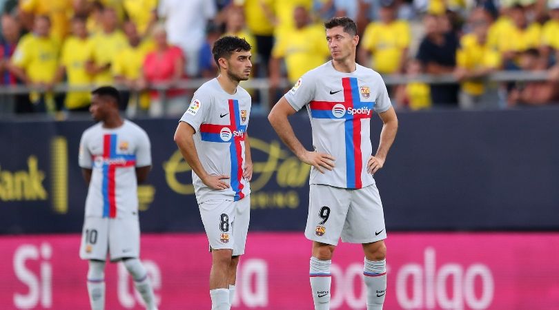 Barcelona players wait while their LaLiga match away to Cadiz is stopped due to a medical emergency in the stands.