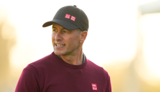 Adam Scott walks down the fairway