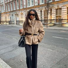 Symphony of Silk in a faux fur jacket