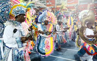 NASSAU, BAHAMAS - JULY 18: Matching band performers Junkanoo dance during the 2017 Youth Commonwealth Games Opening Ceremony on day 1 of the 2017 Youth Commonwealth Games at the Thomas A. Robinson National Stadium on July 18, 2017 in Nassau, Bahamas. (Photo by Mark Kolbe/Getty Images)